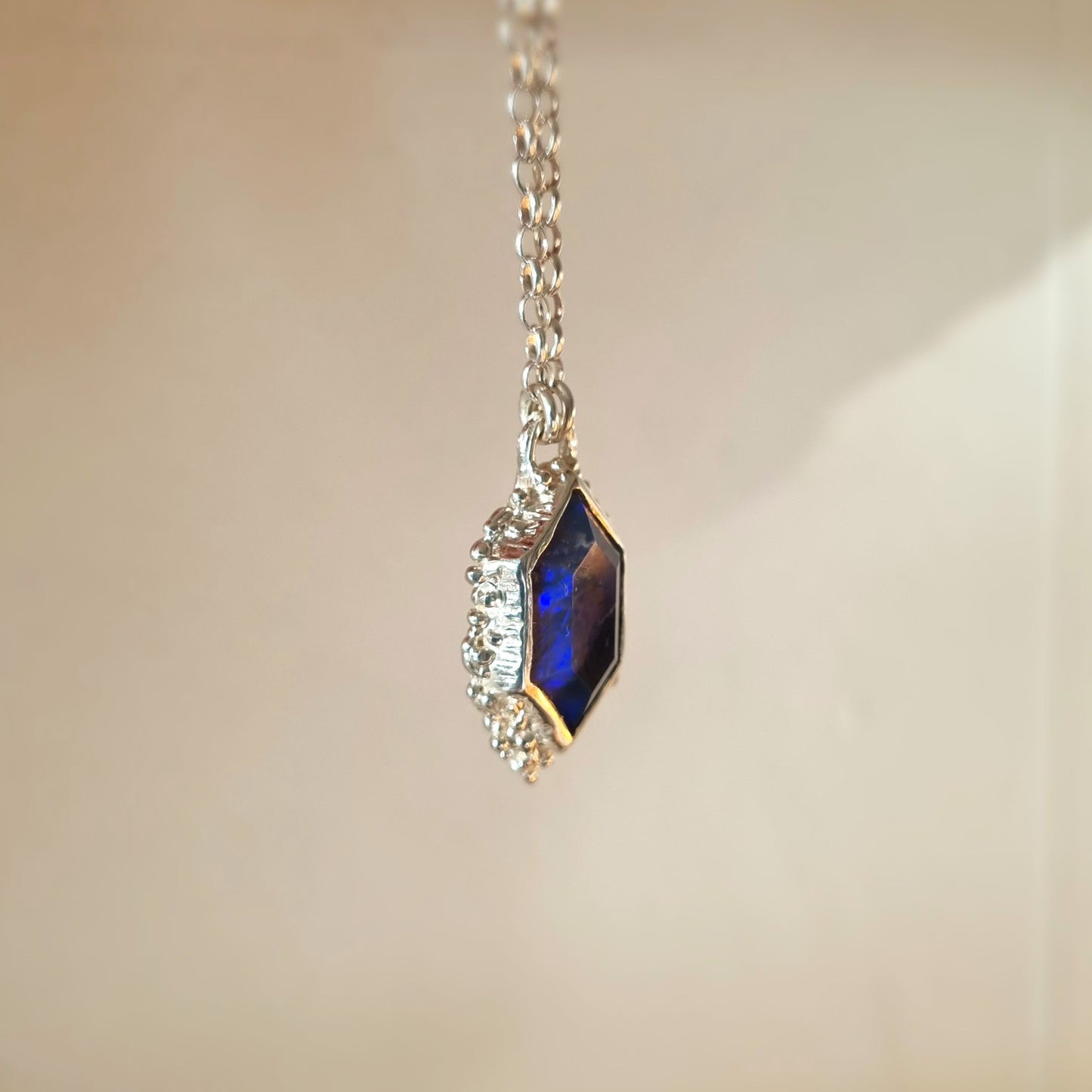 silver seafoam pendant with a black opal by elizabeth french jewellery