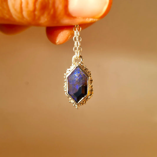 silver seafoam pendant with a black opal held by elizabeth french jewellery